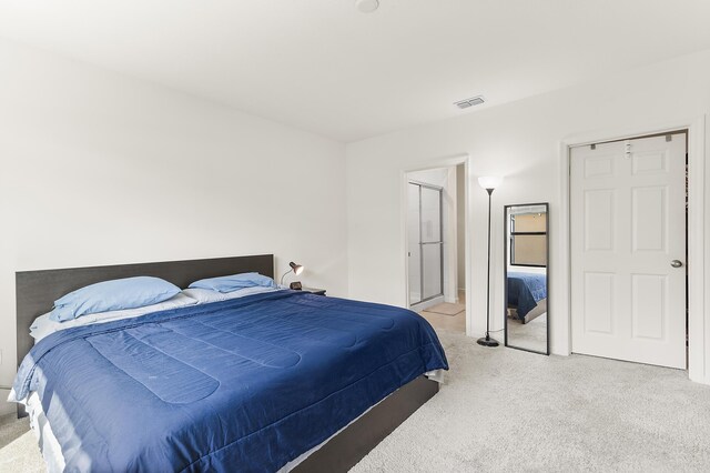 bedroom with carpet and visible vents