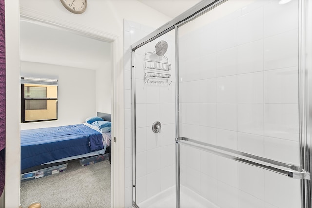 ensuite bathroom featuring a stall shower and connected bathroom