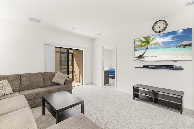 living room with carpet flooring and visible vents