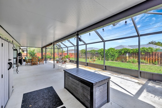 unfurnished sunroom featuring a mountain view