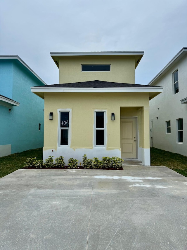 view of front facade featuring a patio area and stucco siding