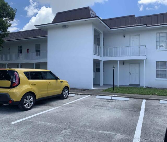 view of property with uncovered parking