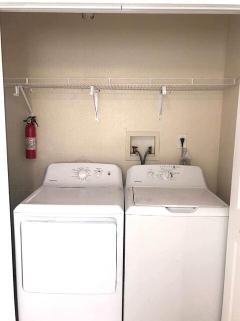 laundry room with washer and dryer and laundry area