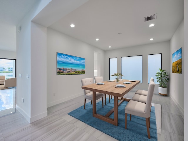 dining space featuring baseboards, visible vents, and recessed lighting