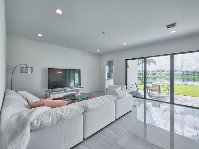 living room with recessed lighting and visible vents