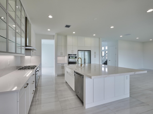 8107 Crystal Downs Ave, Boca Raton, FL 33434 - kitchen featuring stainless steel appliances, modern cabinets, wall chimney exhaust hood, backsplash, and white cabinetry