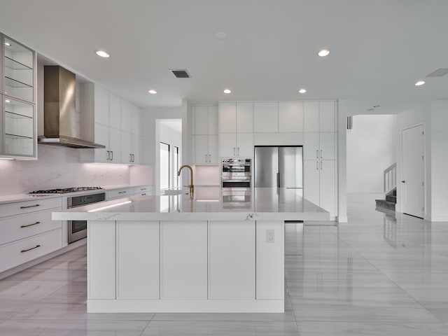 8107 Crystal Downs Ave, Boca Raton, FL 33434 - kitchen with wall chimney exhaust hood, appliances with stainless steel finishes, modern cabinets, a large island with sink, and white cabinets