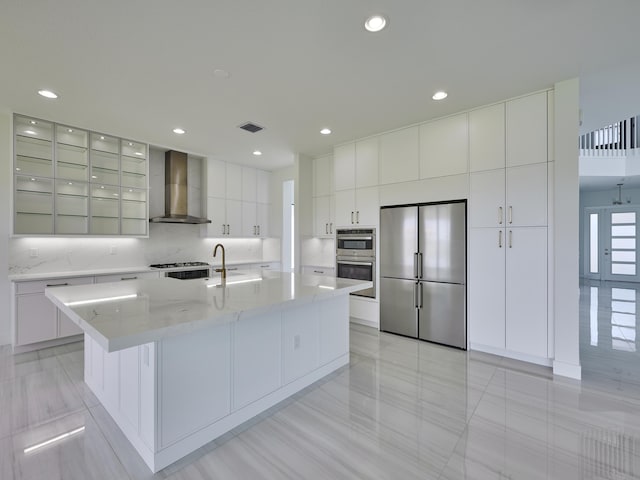 8107 Crystal Downs Ave, Boca Raton, FL 33434 - kitchen with wall chimney range hood, appliances with stainless steel finishes, modern cabinets, a spacious island, and white cabinets