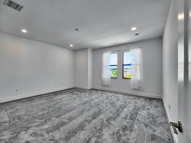 8107 Crystal Downs Ave, Boca Raton, FL 33434 - unfurnished room featuring carpet, a textured ceiling, and recessed lighting