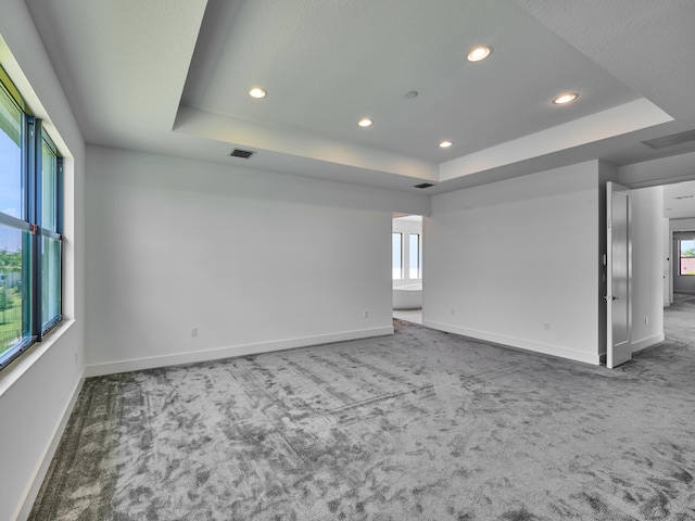 8107 Crystal Downs Ave, Boca Raton, FL 33434 - spare room featuring a raised ceiling, carpet floors, and recessed lighting