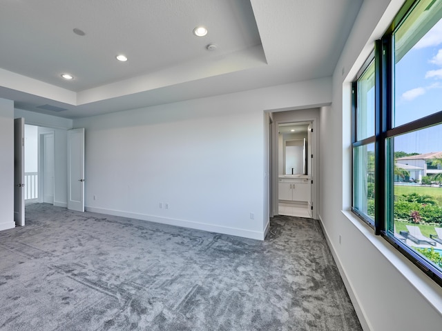 8107 Crystal Downs Ave, Boca Raton, FL 33434 - unfurnished bedroom with carpet, multiple windows, recessed lighting, a raised ceiling, and connected bathroom