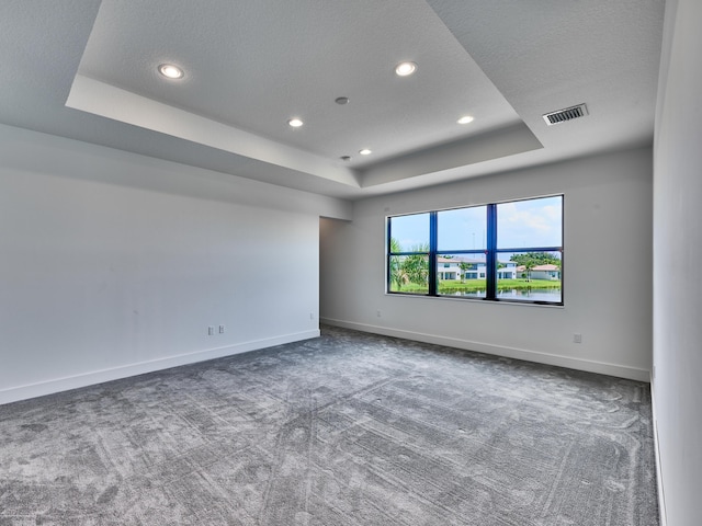 8107 Crystal Downs Ave, Boca Raton, FL 33434 - unfurnished room with a raised ceiling, carpet flooring, recessed lighting, and a textured ceiling