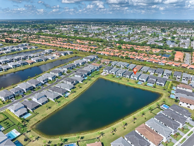 birds eye view of property featuring a water view and a residential view