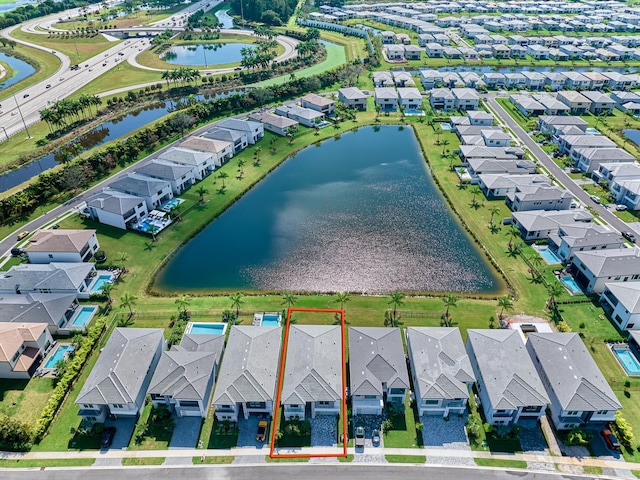 aerial view featuring a water view and a residential view