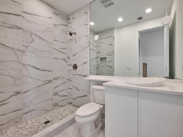 8107 Crystal Downs Ave, Boca Raton, FL 33434 - bathroom featuring vanity, marble look tile flooring, a marble finish shower, and recessed lighting