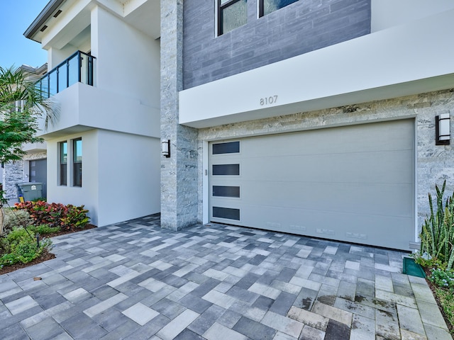 exterior space with decorative driveway