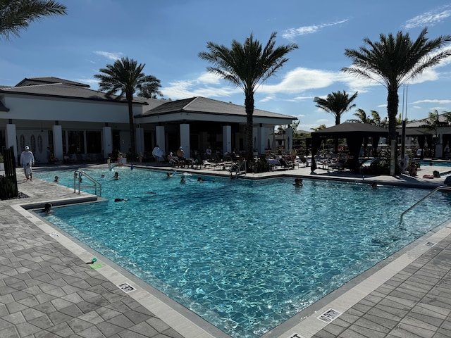 community pool featuring a patio area