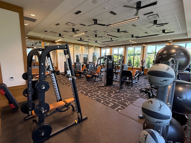 exercise room featuring a paneled ceiling