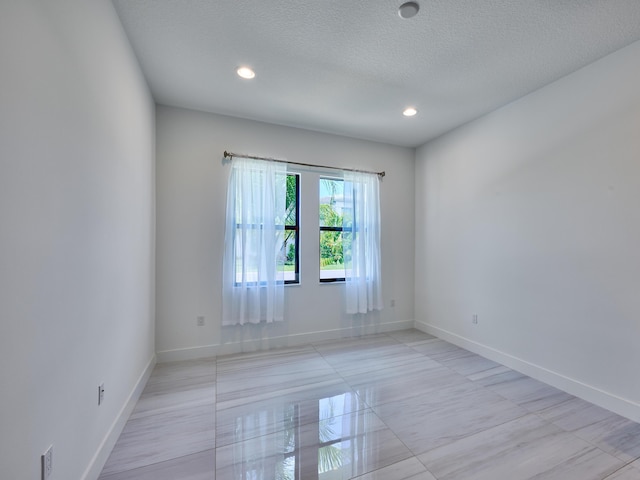 8107 Crystal Downs Ave, Boca Raton, FL 33434 - spare room with a textured ceiling and recessed lighting