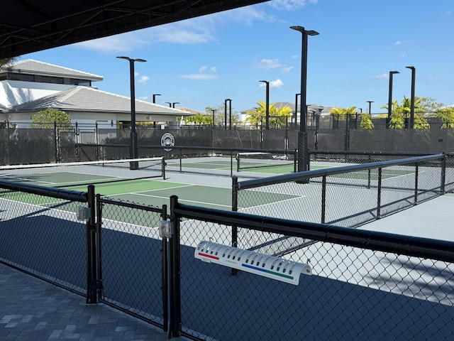 view of sport court with fence