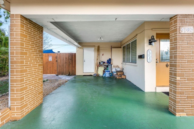 view of patio featuring fence