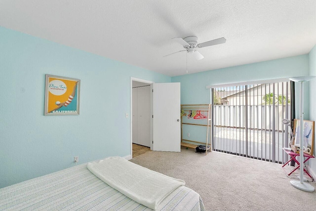 8202 Ambach Way, Hypoluxo, FL 33462 - bedroom with carpet flooring, a ceiling fan, and a textured ceiling
