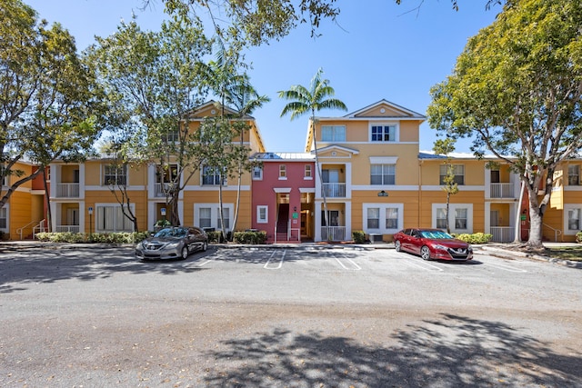 view of property with uncovered parking