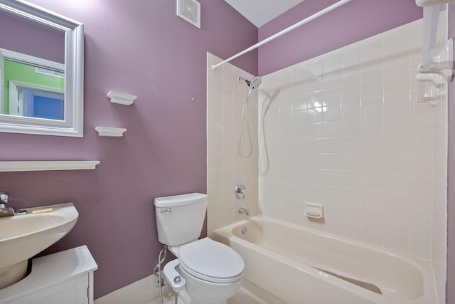 bathroom with shower / washtub combination, visible vents, a sink, and toilet