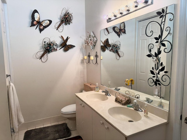 224 NW Pleasant Grove Way, Port Saint Lucie, FL 34986 - full bath with tile patterned floors, toilet, double vanity, and a sink