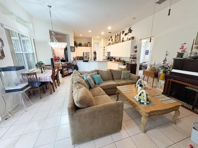 living room featuring light tile patterned floors and recessed lighting