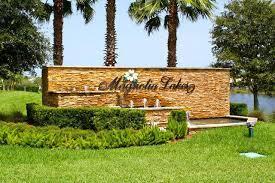 224 NW Pleasant Grove Way, Port Saint Lucie, FL 34986 - community sign featuring a yard and a water view