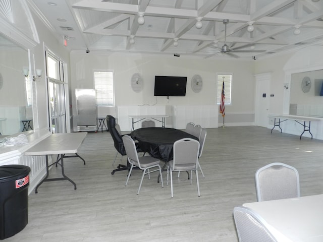 dining room featuring beamed ceiling, light wood-style flooring, coffered ceiling, and visible vents