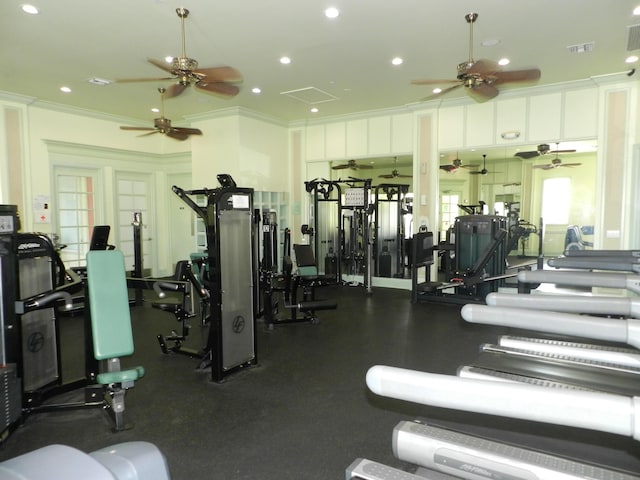 gym with visible vents, recessed lighting, and crown molding