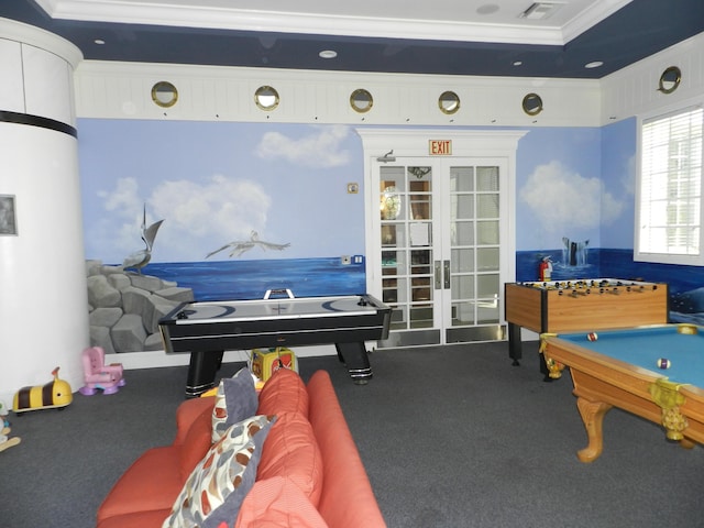 recreation room with carpet, french doors, visible vents, and ornamental molding