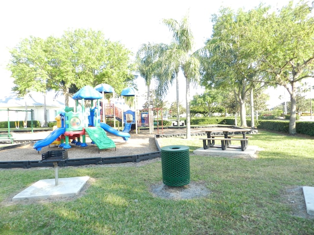 communal playground featuring a lawn