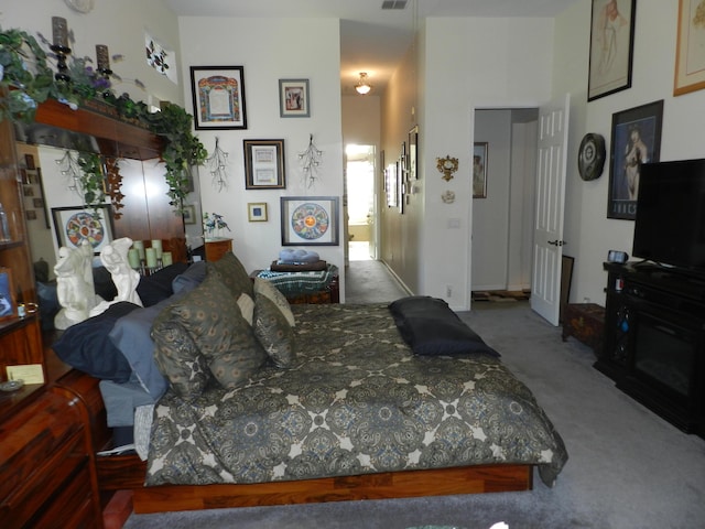 carpeted bedroom with visible vents