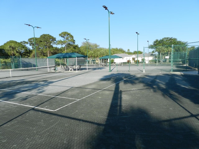 view of sport court with fence