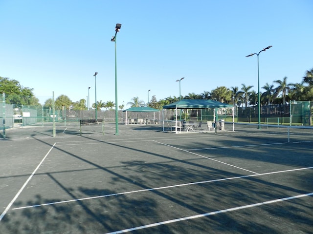 224 NW Pleasant Grove Way, Port Saint Lucie, FL 34986 - view of tennis court with a gazebo and fence