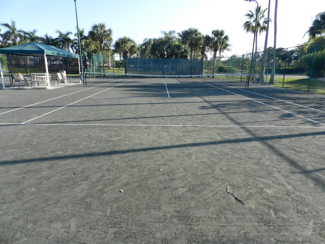 view of sport court with fence