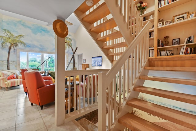 staircase featuring tile patterned floors