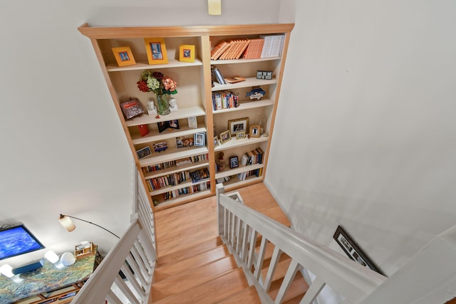 stairs with wood finished floors