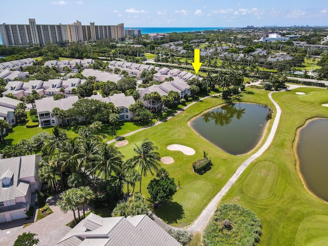 bird's eye view featuring a water view and golf course view