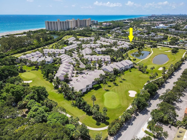 aerial view featuring golf course view and a water view