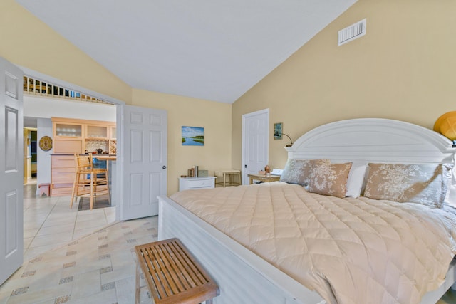 bedroom featuring high vaulted ceiling, visible vents, and light tile patterned flooring