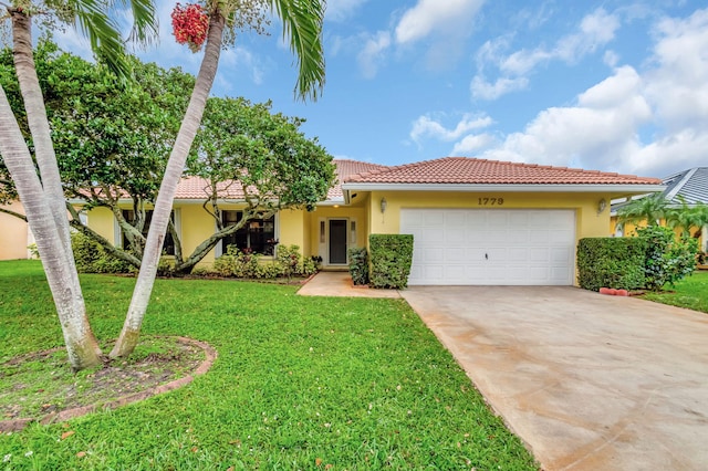 ranch-style house featuring an attached garage, a front yard, a tile roof, and stucco siding