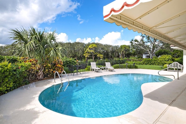 view of pool featuring a patio area and a fenced in pool