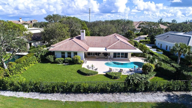 back of house with a patio area, a fenced backyard, a tiled roof, and stucco siding