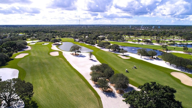 birds eye view of property featuring golf course view and a water view