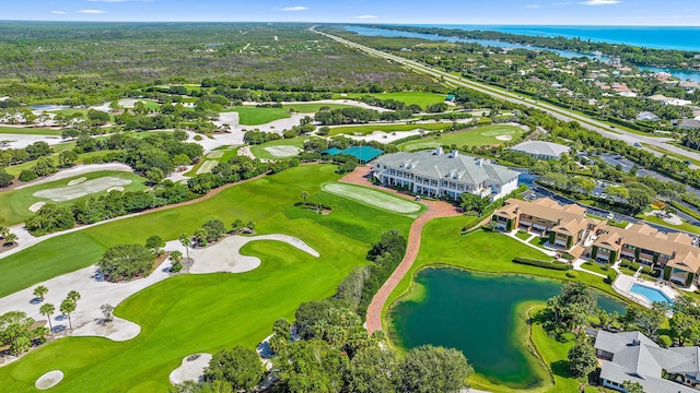 aerial view featuring a residential view, a water view, and golf course view