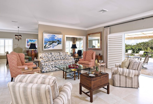 living area featuring a healthy amount of sunlight, crown molding, and an inviting chandelier